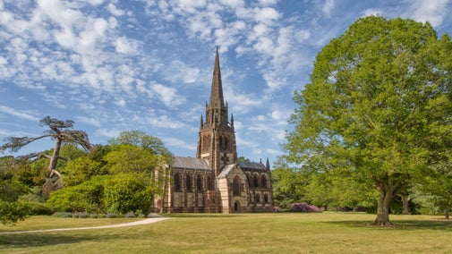 Looking across an expanse of grass towards the Chapel at Clumber Park
